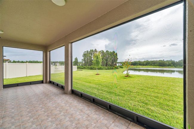 large, screened patio with water view | Image 57