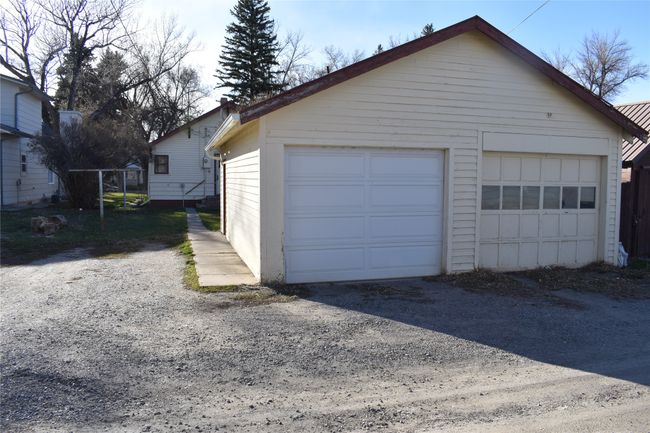 garage with parking beside | Image 24