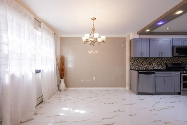 Dining area with an inviting chandelier | Image 8