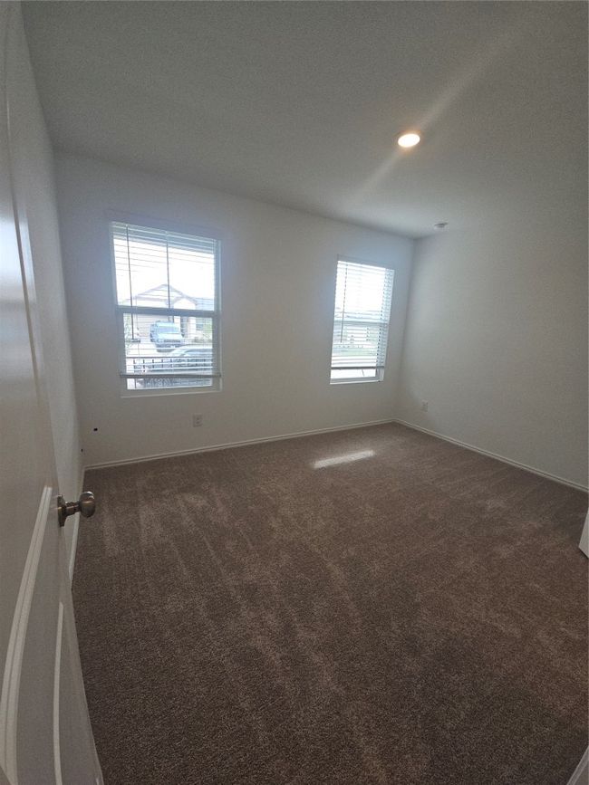 Carpeted empty room with baseboards and recessed lighting | Image 10