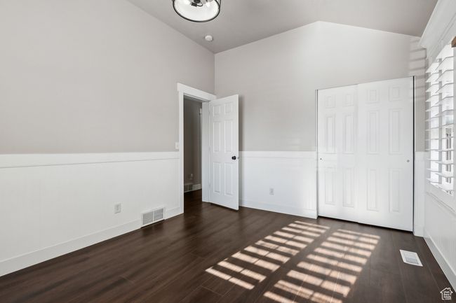 Unfurnished bedroom featuring a closet and dark wood-type flooring | Image 24