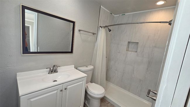 Full bathroom featuring vanity, tiled shower, and recessed lighting | Image 16