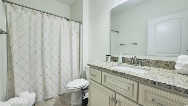 Full bathroom with vanity and a shower with shower curtain | Image 12