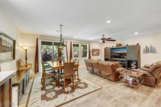 Dining room with visible vents, ceiling fan, recessed lighting, and light wood-style floors | Image 19