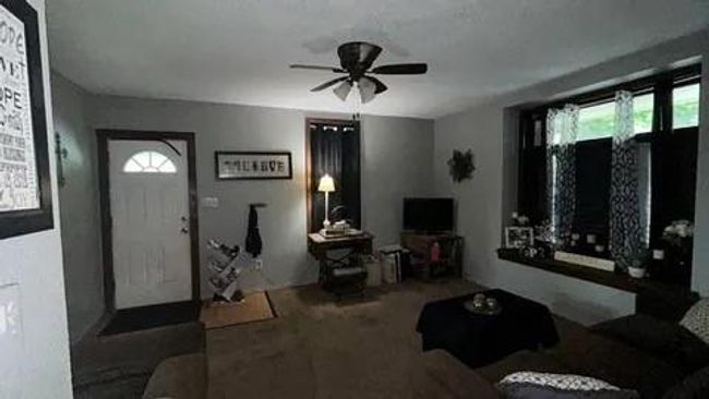 Living room featuring ceiling fan | Image 5