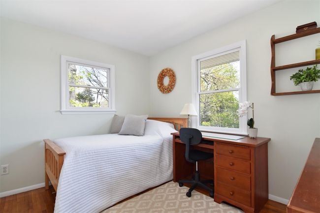 Bedroom featuring light wood-style flooring and baseboards | Image 9