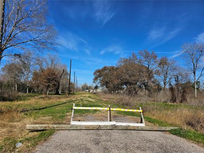 The property features accessible light poles and road access on both the front and back | Image 3