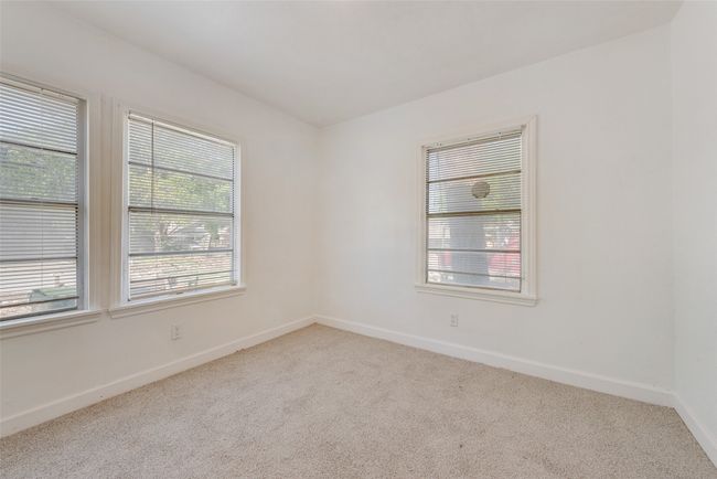 Carpeted spare room with baseboards | Image 7