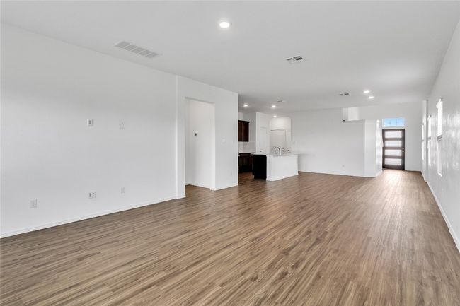 Unfurnished living room featuring wood finished floors and recessed lighting | Image 8