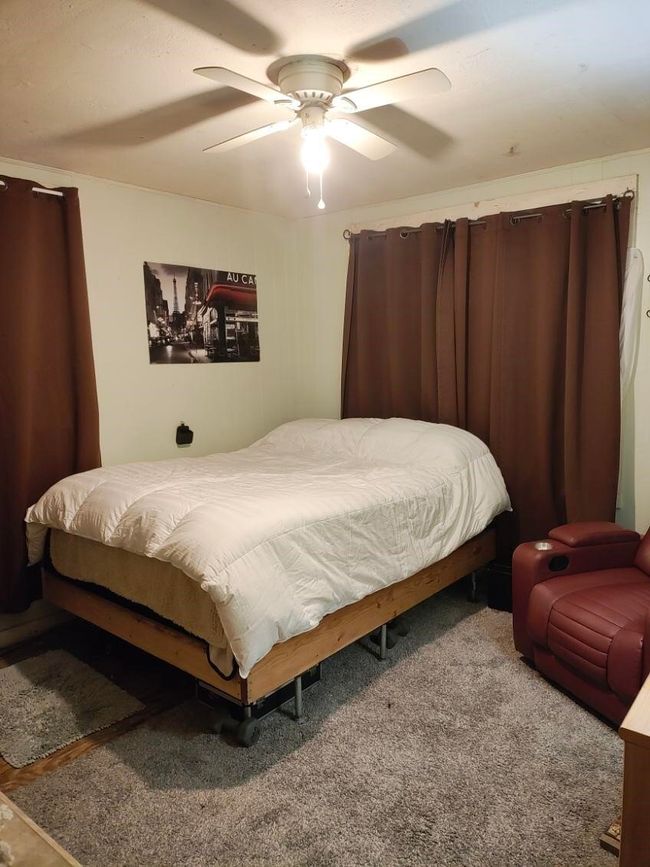 Carpeted bedroom featuring a ceiling fan | Image 6