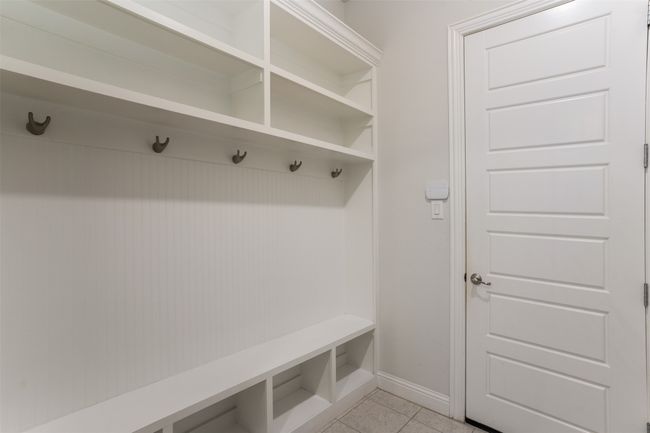 Mudroom featuring baseboards and light tile patterned floors | Image 19