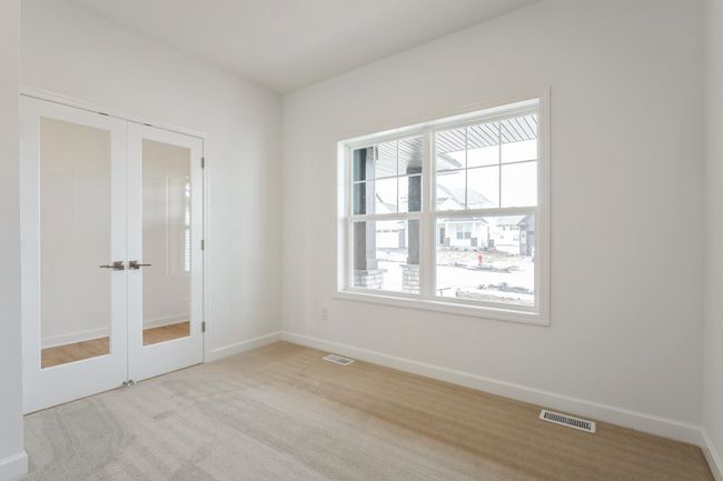 Photo is of the actual home. This home features a main level study. Perfect for those working from home or those who want an office space to stay organized. | Image 6