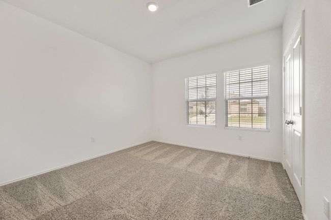 Empty room featuring plenty of natural light and carpet | Image 25