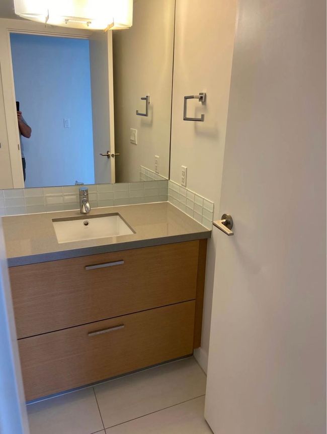 Bathroom featuring tile patterned floors and vanity | Image 14