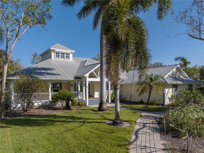 Welcome Home! Key West style home with Metal Roof and Paver Sidewalks | Image 1