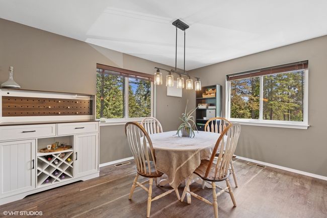 Dining area with baseboards and dark wood-style floors | Image 6