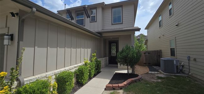 Doorway to property with board and batten siding | Image 4