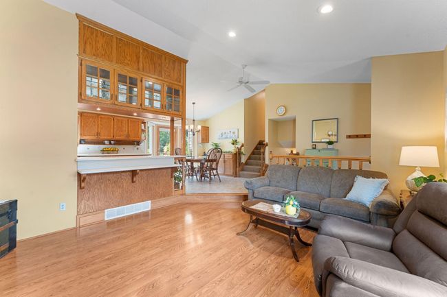 Sight-lines to the kitchen and dining room create an open flow for entertaining. | Image 9