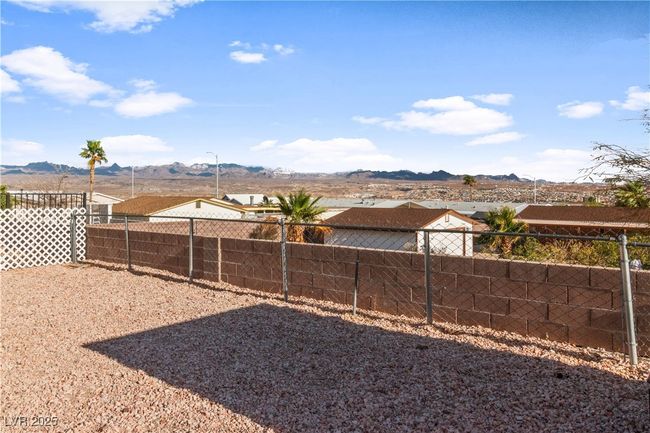 View of yard featuring a fenced backyard and a mountain view | Image 43