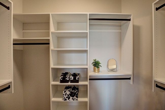 Spacious closet with a barn door | Image 29