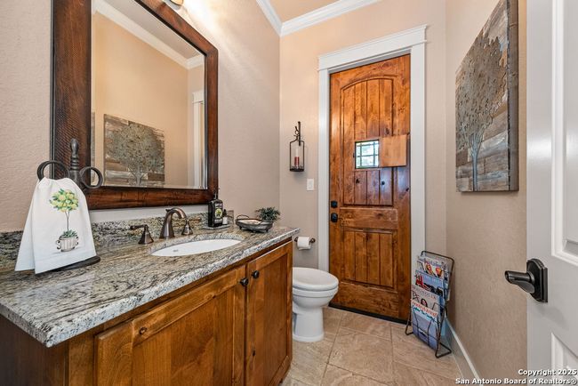 1/2 bath with door leading to back yard | Image 30