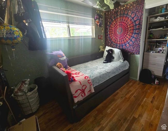 Bedroom featuring wood finished floors | Image 13