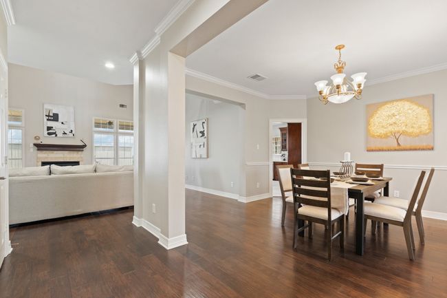from front entrance looking into the formal dining and living area. Engineered hardwood floors | Image 10