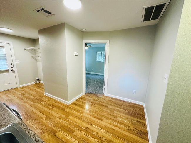 Spare room featuring light wood-style floors | Image 10