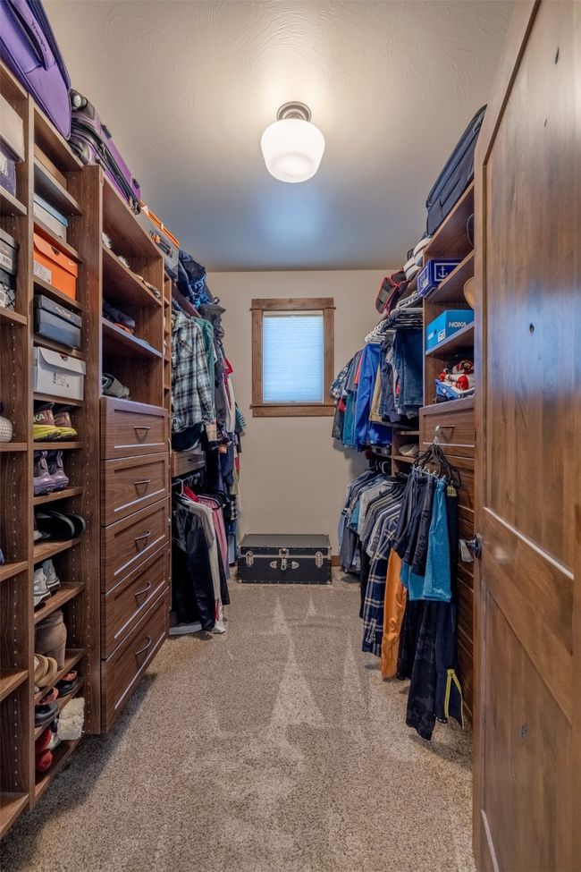Spacious closet with carpet flooring | Image 21
