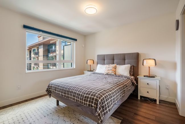 Bedroom with baseboards and wood finished floors | Image 16