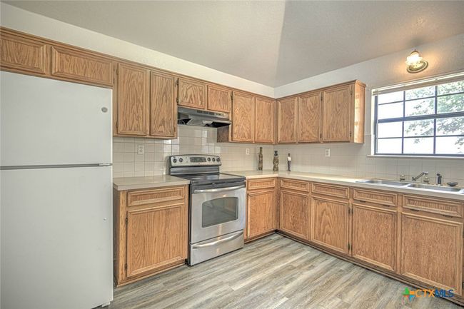 Wide angle view of kitchen | Image 17
