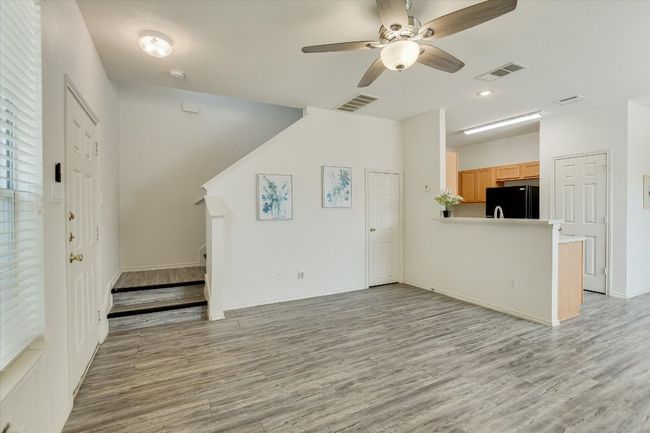 Living room with stairway leading upstairs | Image 17