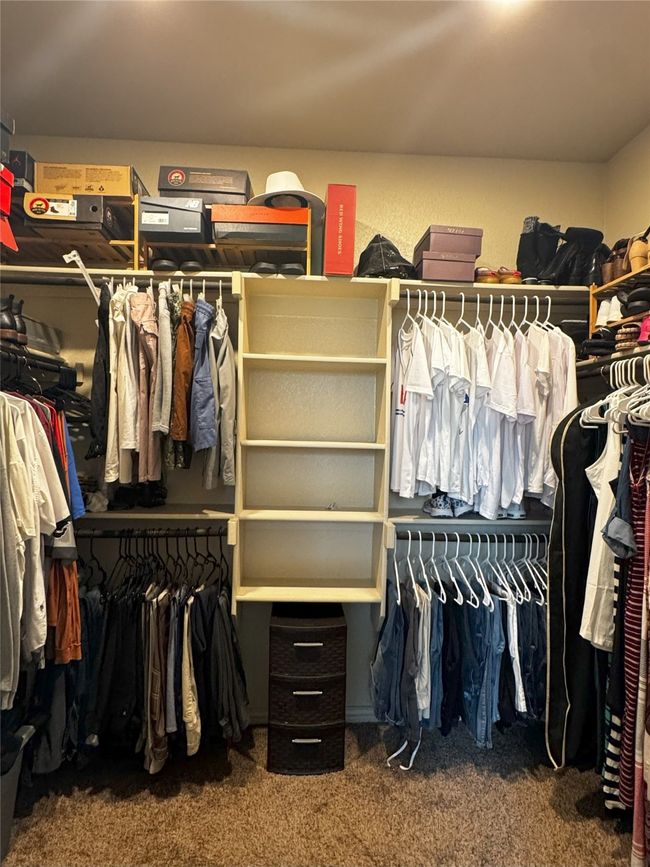 Spacious Master closet featuring carpet | Image 11