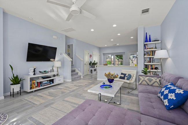 Living room with baseboards, light wood-style flooring, visible vents, and recessed lighting | Image 9