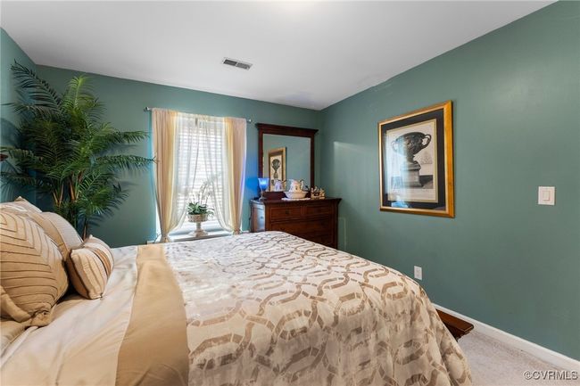 Bedroom with baseboards, visible vents, and carpet floors | Image 28