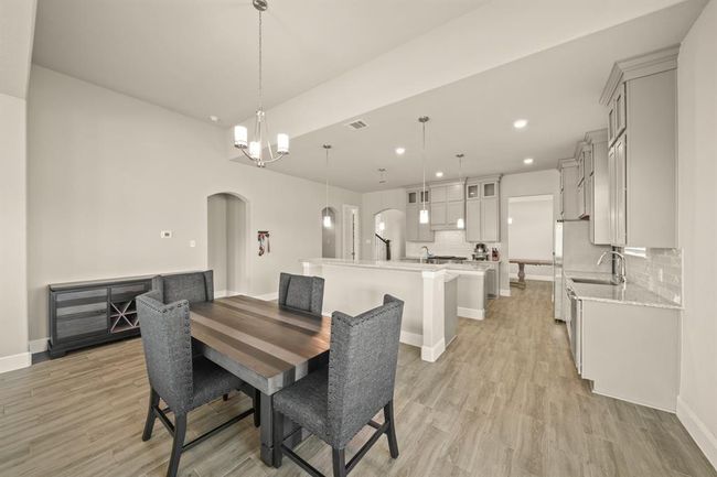 Connected to both the kitchen and living room for effortless movement and conversation. | Image 13