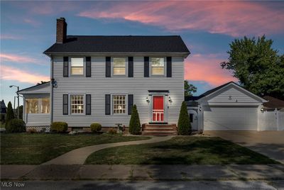 Colonial-style house featuring a yard | Image 1