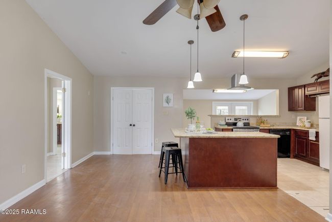 open concept kitchen / living | Image 8