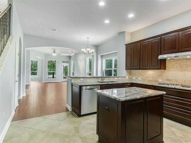The floor plan offers a nice open layout between the kitchen, dining and living areas. | Image 8