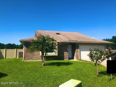 7038 Cane Grass Lane E, House other with 3 bedrooms, 2 bathrooms and null parking in Jacksonville FL | Image 1