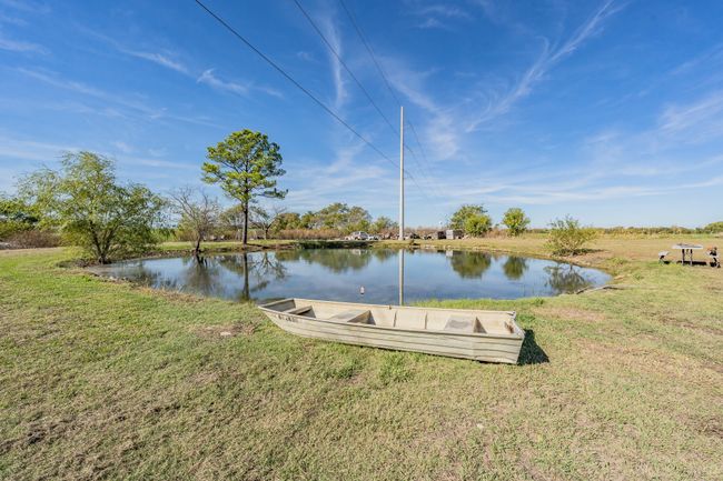 Dock area featuring a lawn and a water view | Image 12