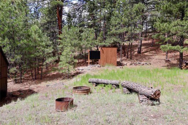 View of yard featuring a fire pit | Image 10