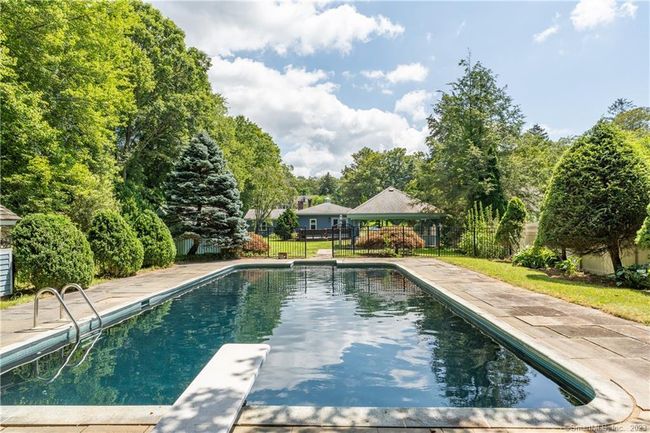 So inviting on a summer day! And, because of the location the covered pool in the off-season is neatly tucked away from the house and back yard. | Image 30