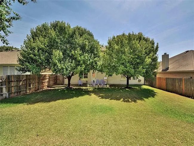 View of fenced backyard | Image 21