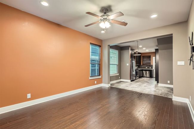 Unfurnished living room featuring ceiling fan, light wood-style floors, and recessed lighting | Image 5