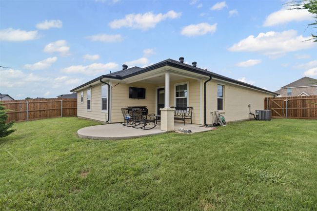 Rear view of property with central AC and a patio area | Image 24