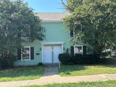 View of front of property featuring a front lawn | Image 1