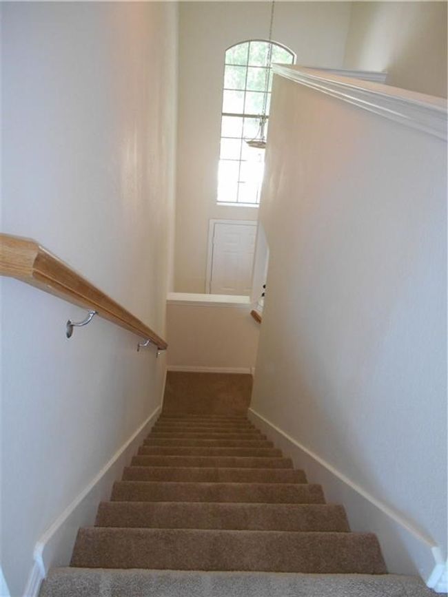 Staircase with carpet floors and baseboards | Image 16