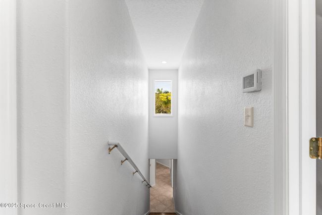 upstairs looking downstairs/window above allows for extra natural sunlight | Image 67