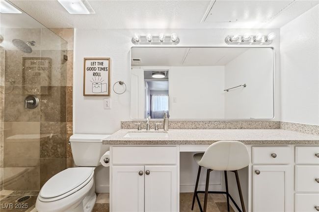 Full bath with toilet, a tile shower, and vanity | Image 21